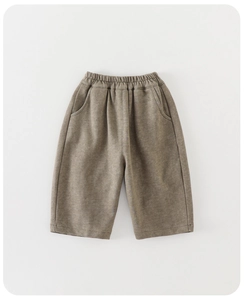 Detail of toddler olive green casual trousers with elastic waistband and side pockets