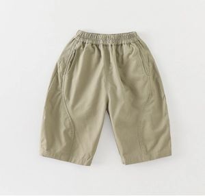 Detail of khaki cotton toddler shorts with elastic waistband and side pocket stitching