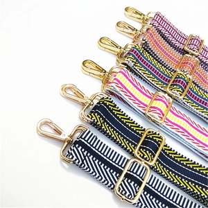 Adjustable wide replacement straps with colorful stripes and gold metal hardware for bags