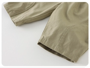 Detailed close-up of double-stitched reinforced cuffs on cotton toddler trousers