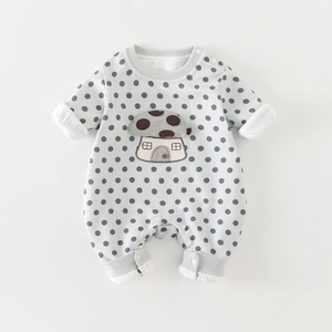 Cute long-sleeved baby romper with polka dot pattern and mushroom embroidery detail