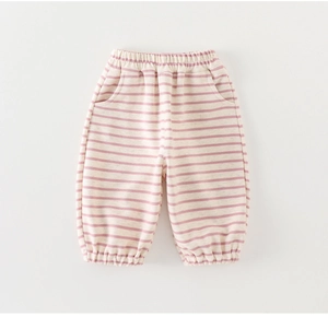 Detail of pink and beige striped toddler pants with elastic waistband and pockets