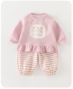 Detail of pink toddler sweatshirt with rabbit print and striped pants with elastic cuffs