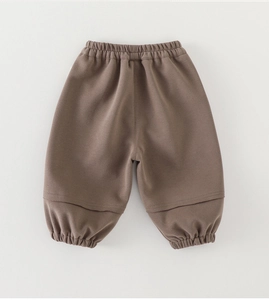 Detailed view of brown toddler cotton sweatpants with elastic waist and ribbed ankle cuffs