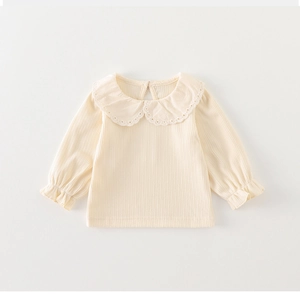 Detail of baby girl cream ribbed knit shirt featuring an embroidered Peter Pan collar