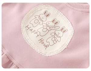 Detail of pink cotton sweatshirt with lace-trimmed bunny patch and Happy Hour text
