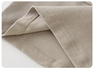 Detail of premium knitting fabric and reinforced double stitching on kids shirt