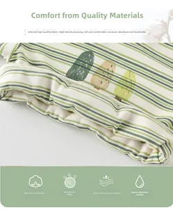 Close-up of baby striped cotton top featuring a cute cactus print and soft knit texture