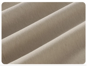 Macro detail of breathable beige cotton knit fabric with fine stitching for kids t-shirt