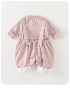 Flat lay of soft knit cotton baby girl long sleeve romper in dusty rose pink color