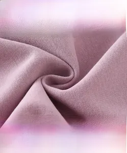 Detailed macro view of soft purple knitted fabric showing breathable high-density weave texture