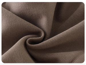 Macro shot of high-density brown knitted fabric texture for children sweatpants