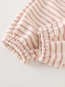 Pink and white striped girls' knit sweater featuring elastic cuffs and soft fabric