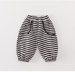 Detail of infant striped cotton joggers featuring elastic waist and dual front pockets