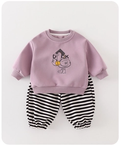 Close-up of baby long sleeve set with cartoon duck print and striped trousers