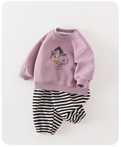Detail of baby tracksuit featuring purple cartoon duck sweatshirt and striped joggers