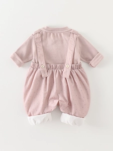 Two-piece baby girl outfit with pink long sleeve shirt and floral suspender pants