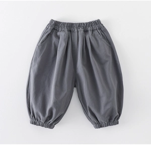 Detail view of dark grey toddler harem pants with elastic waist and ribbed ankle cuffs