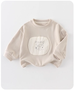 Detail of child cotton sweatshirt featuring round neck and elephant print design