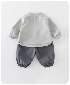 Flat lay detail of baby boy two-piece set featuring grey sweatshirt and matching joggers