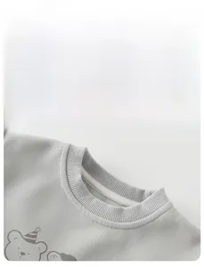 Close-up of ribbed crewneck and high-quality cotton fabric with cute bear print