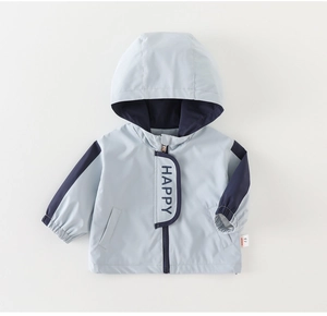Detail of hooded windbreaker jacket for boys featuring zip closure and elastic cuffs