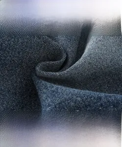 Detail of high-density blue denim fabric texture and soft cotton material for kids' jeans