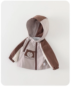 Close-up of baby hooded jacket with cute bear patch embroidery and zip-up details