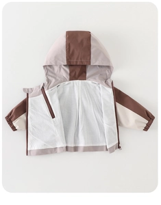 Detail of color-block toddler hooded windbreaker with elastic windproof cuffs and zipper