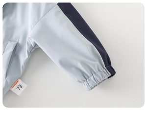 Detail of the elastic cuffs and windproof fabric on this boys' hooded jacket