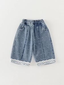 Light blue denim shorts for girls featuring butterfly embroidery and white lace hem