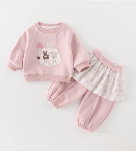 Detail of pink toddler sweatshirt set with cute rabbit print and floral ruffle trim