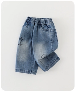 Detailed embroidery of Magic text and bear pattern on kids blue denim jeans