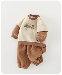Detailed flat lay of beige and caramel baby tracksuit with guinea pig print design