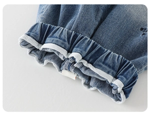 Detail of baby jeans elastic waistband with white rolled lining and neat stitching