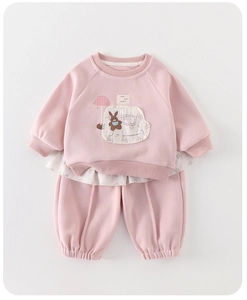 Detail of pink toddler sweatshirt set with cute rabbit embroidery and floral ruffle hem