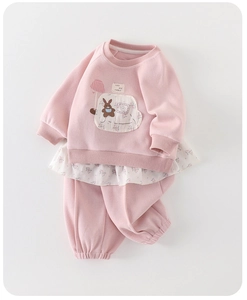Detail of pink toddler sweatshirt set featuring floral hem and cute rabbit embroidery