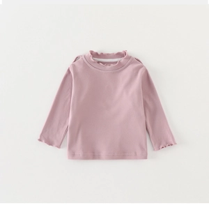 Detailed view of pink long sleeve cotton shirt with frilled collar and ruffled cuffs