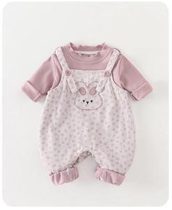 Detail of pink long-sleeve top with ruffled collar and floral rabbit overall set for baby