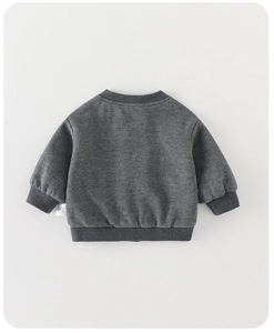 Detail of dark grey toddler sweatshirt featuring ribbed cuffs and soft knit texture
