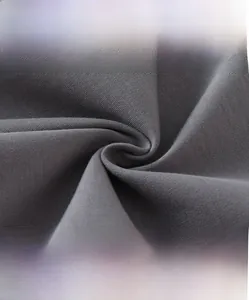 Close-up of soft dark gray knit cotton fabric showing breathable texture and skin-friendly feel