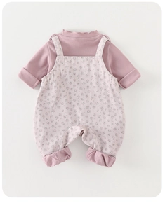 Detail of baby girl floral overalls and long sleeve turtleneck shirt set fabric