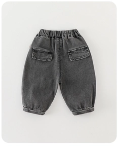 Detail view of boys gray washed denim joggers with elastic waist and back flap pockets