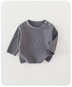 Detail of dark grey baby t-shirt featuring shoulder buttons and a cute bear clock print