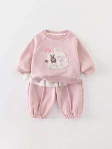 Pink toddler two-piece tracksuit with cute rabbit print and floral ruffle hem detail