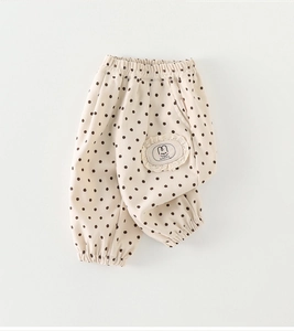 Detail of baby polka dot pants with cute rabbit patch and elastic soft cotton cuffs