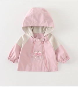 Detail of pink and beige kids hooded windbreaker with cute animal embroidery