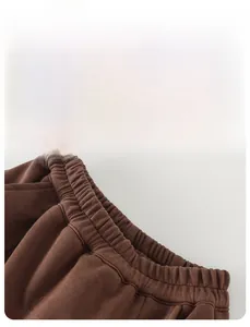 Close-up of elastic waistband on thick cotton kids joggers with soft fleece texture