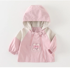 Detail view of pink girls windbreaker with hood and cute rabbit embroidery design