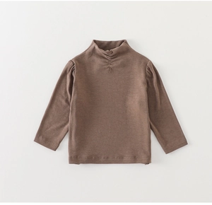 Detailed view of coffee brown cotton knit base layer with a pleated turtle neck design